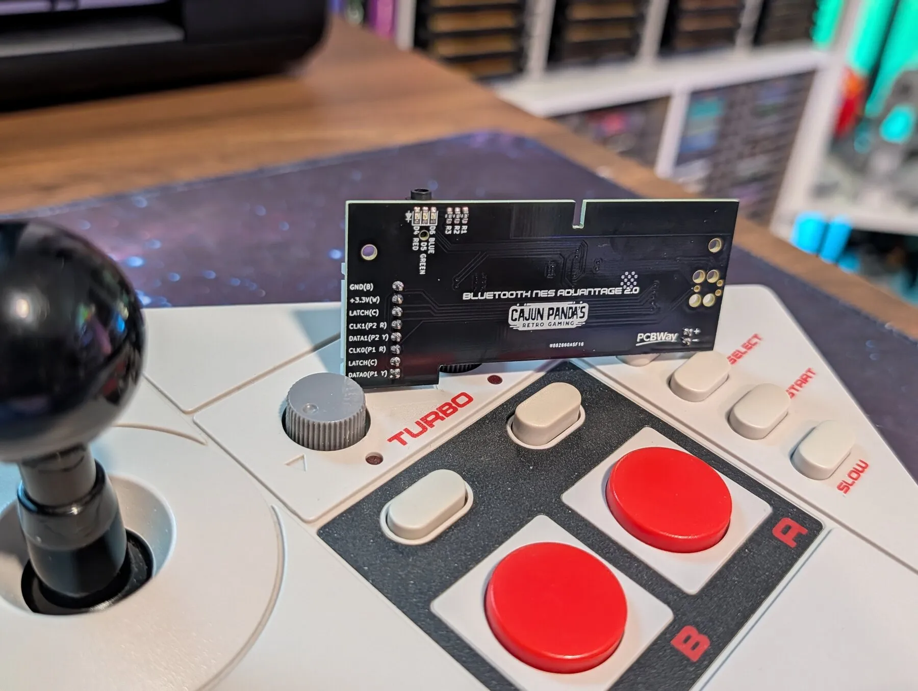 The 2.0 board drops in where the cable used to be. No case cutting, no added buttons.
